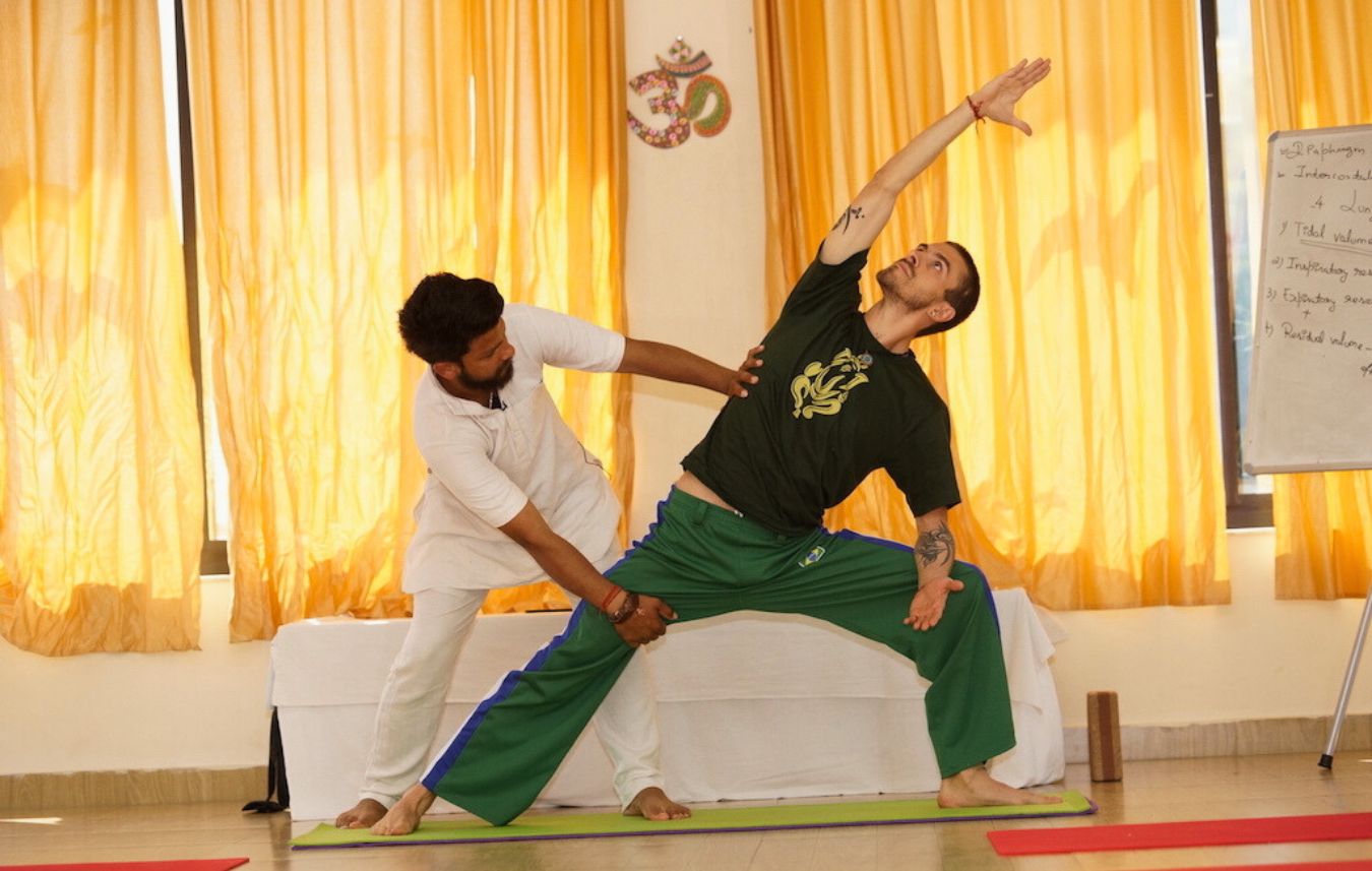 Alignment adjustment yoga session in Rishikesh at Kundalini Yogashala